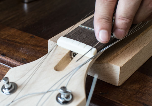 Building a guitar - nut adjustment to control string action 